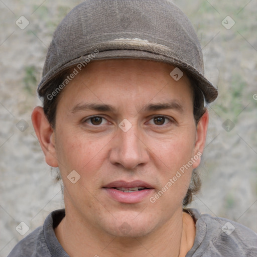 Joyful white adult male with short  brown hair and grey eyes