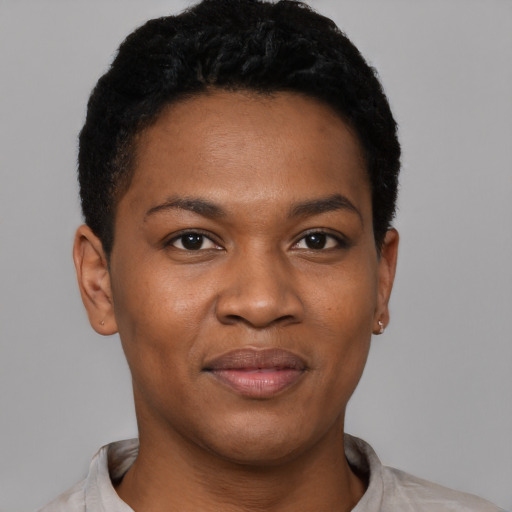 Joyful black young-adult female with short  black hair and brown eyes