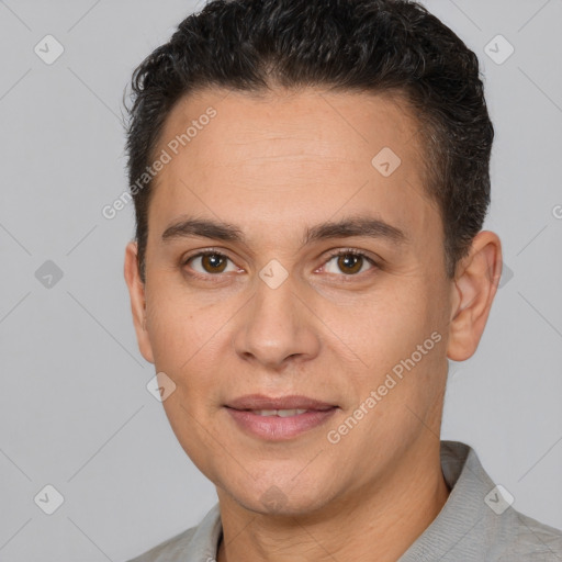 Joyful white adult male with short  brown hair and brown eyes