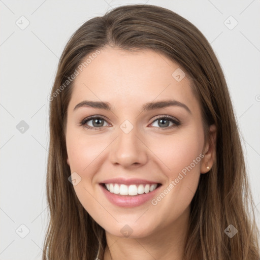 Joyful white young-adult female with long  brown hair and grey eyes