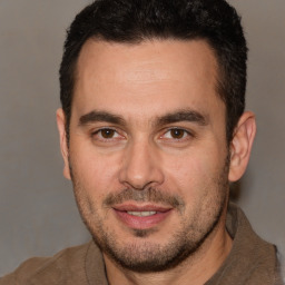 Joyful white adult male with short  brown hair and brown eyes
