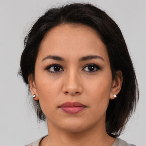 Neutral asian young-adult female with medium  brown hair and brown eyes