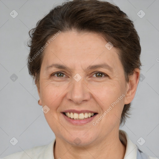 Joyful white adult female with short  brown hair and brown eyes