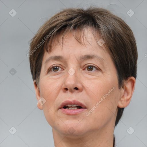 Joyful white adult female with short  brown hair and brown eyes