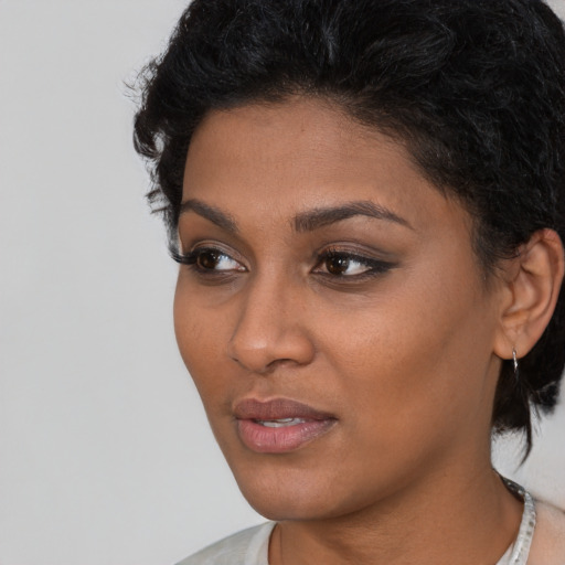 Neutral latino young-adult female with short  black hair and brown eyes