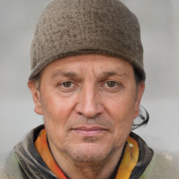 Joyful white adult male with short  brown hair and grey eyes