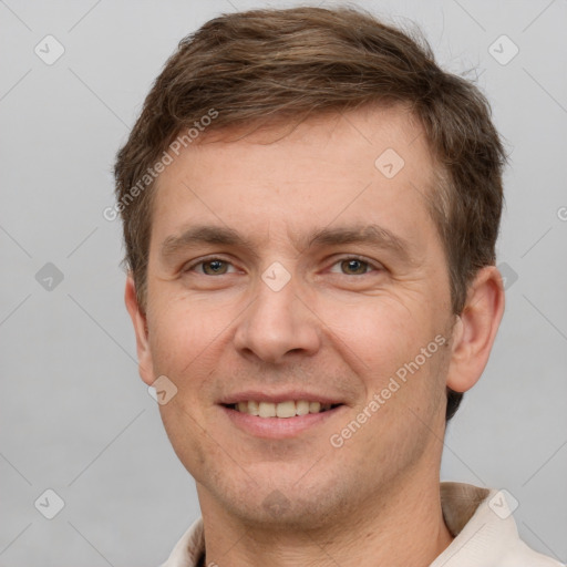 Joyful white adult male with short  brown hair and grey eyes