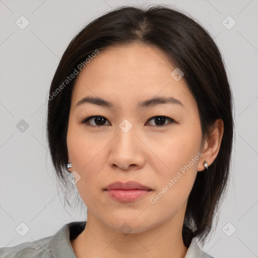 Neutral asian young-adult female with medium  brown hair and brown eyes