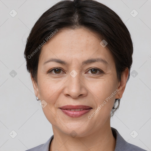 Joyful white adult female with medium  brown hair and brown eyes