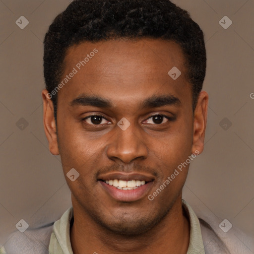 Joyful black young-adult male with short  brown hair and brown eyes