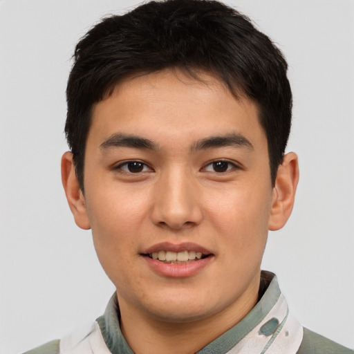 Joyful asian young-adult male with short  brown hair and brown eyes