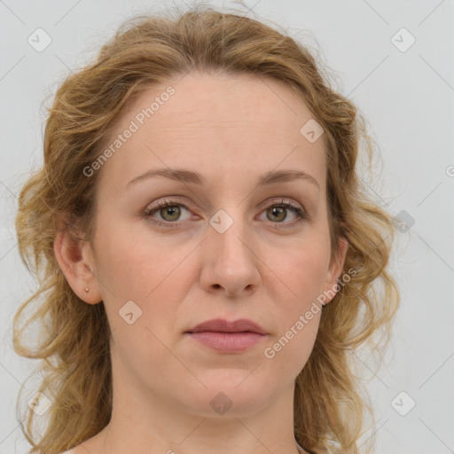 Joyful white adult female with medium  brown hair and blue eyes