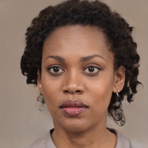Neutral black young-adult female with medium  black hair and brown eyes