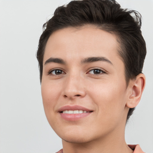 Joyful white young-adult female with short  brown hair and brown eyes