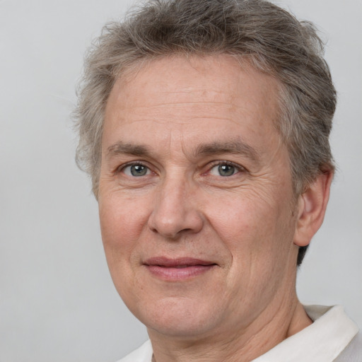 Joyful white middle-aged male with short  brown hair and brown eyes