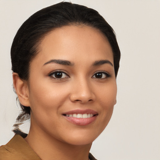 Joyful latino young-adult female with medium  brown hair and brown eyes