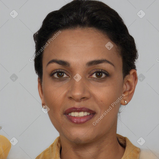 Joyful black young-adult female with short  black hair and brown eyes