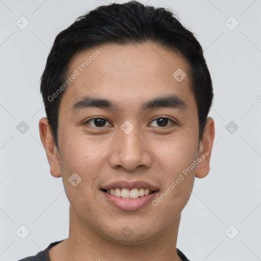 Joyful asian young-adult male with short  black hair and brown eyes