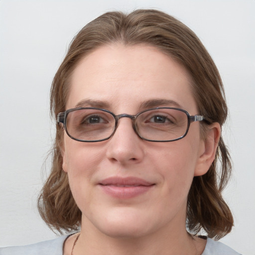 Joyful white young-adult female with medium  brown hair and blue eyes