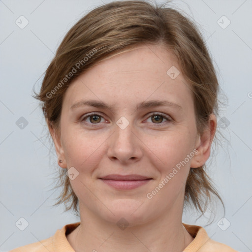 Joyful white young-adult female with medium  brown hair and grey eyes