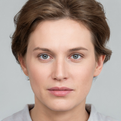 Neutral white young-adult female with short  brown hair and grey eyes