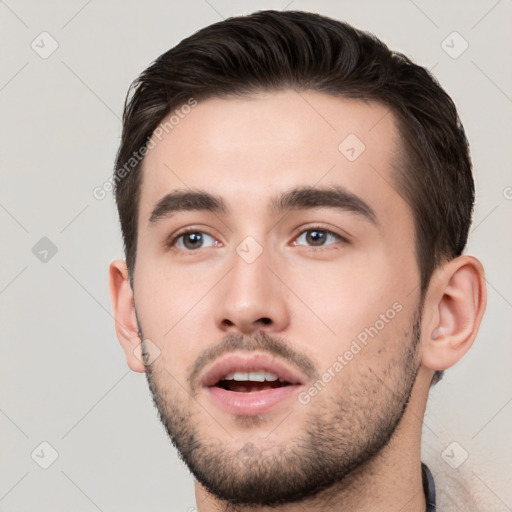 Neutral white young-adult male with short  brown hair and brown eyes