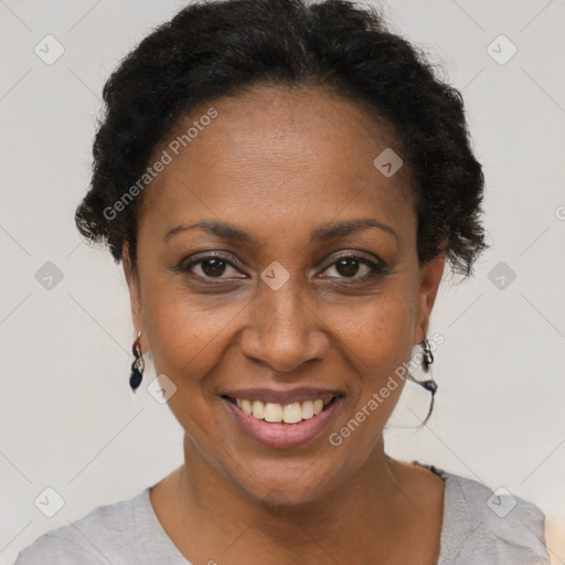 Joyful black adult female with short  brown hair and brown eyes