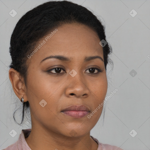 Joyful black young-adult female with medium  brown hair and brown eyes