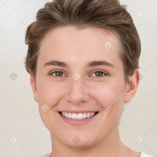 Joyful white young-adult female with short  brown hair and grey eyes