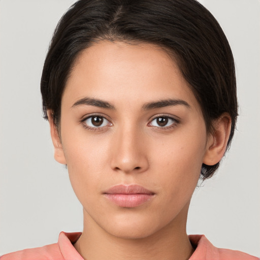 Neutral white young-adult female with short  brown hair and brown eyes