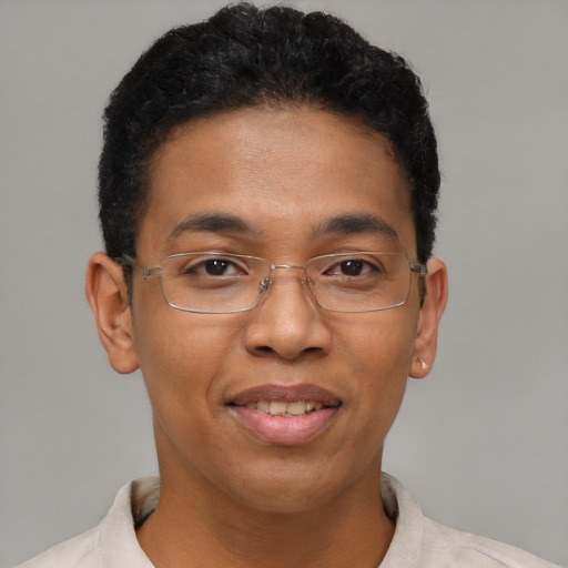 Joyful black young-adult male with short  brown hair and brown eyes