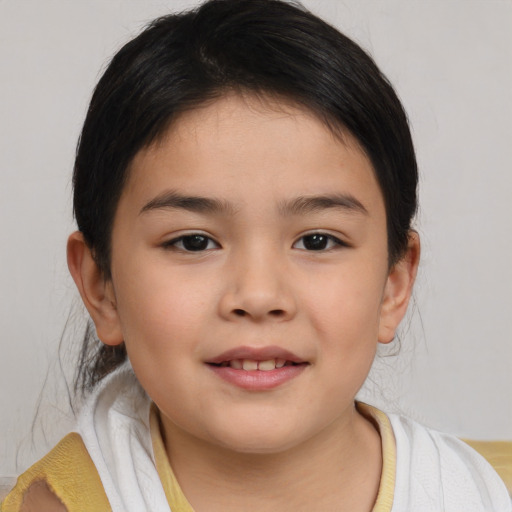 Joyful asian child female with medium  brown hair and brown eyes