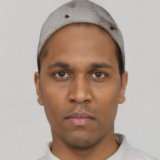 Neutral black young-adult male with short  black hair and brown eyes