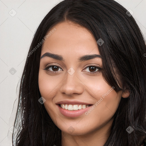 Joyful white young-adult female with long  black hair and brown eyes