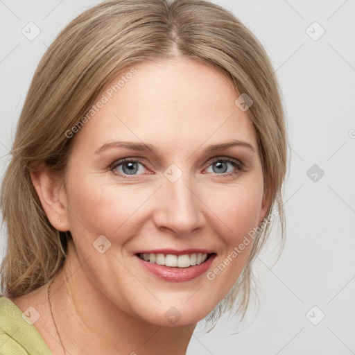 Joyful white young-adult female with medium  brown hair and blue eyes