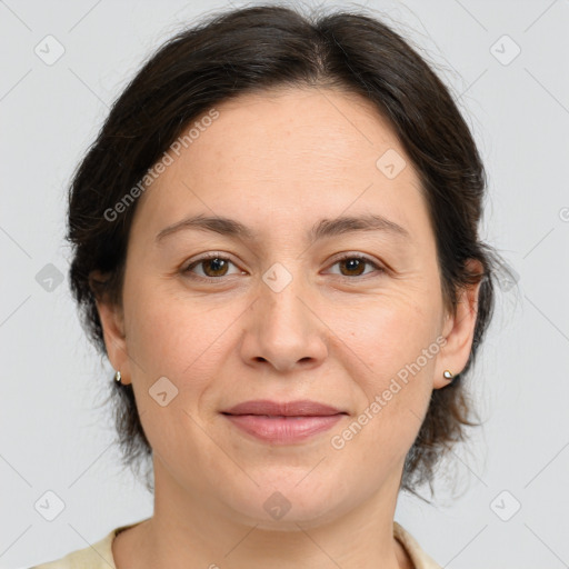 Joyful white adult female with medium  brown hair and brown eyes