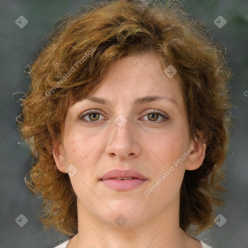 Joyful white young-adult female with medium  brown hair and green eyes