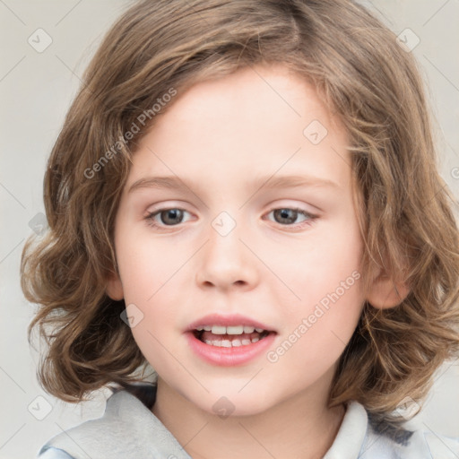 Joyful white child female with medium  brown hair and blue eyes