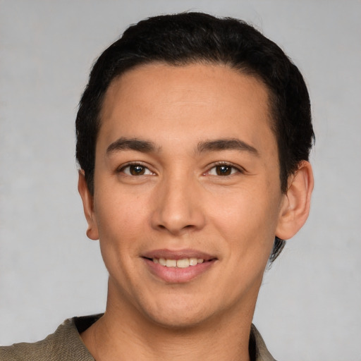 Joyful white young-adult male with short  black hair and brown eyes