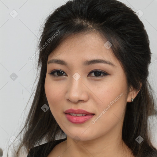 Joyful asian young-adult female with long  brown hair and brown eyes