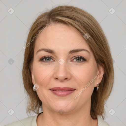 Joyful white young-adult female with medium  brown hair and green eyes