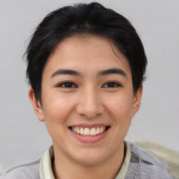 Joyful asian young-adult female with short  brown hair and brown eyes