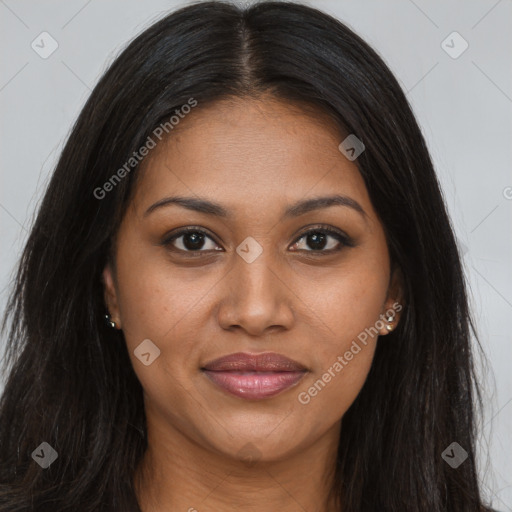 Joyful black young-adult female with long  brown hair and brown eyes