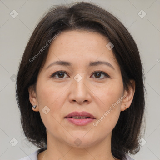 Joyful white adult female with medium  brown hair and brown eyes