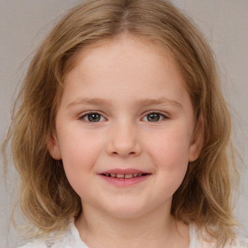 Joyful white child female with medium  brown hair and brown eyes