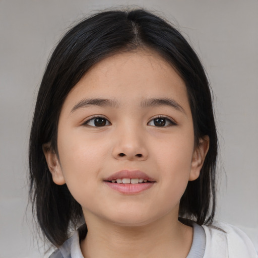 Joyful asian child female with medium  brown hair and brown eyes