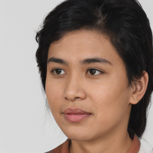 Neutral asian young-adult female with medium  brown hair and brown eyes