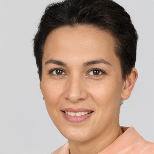 Joyful white young-adult female with short  brown hair and brown eyes