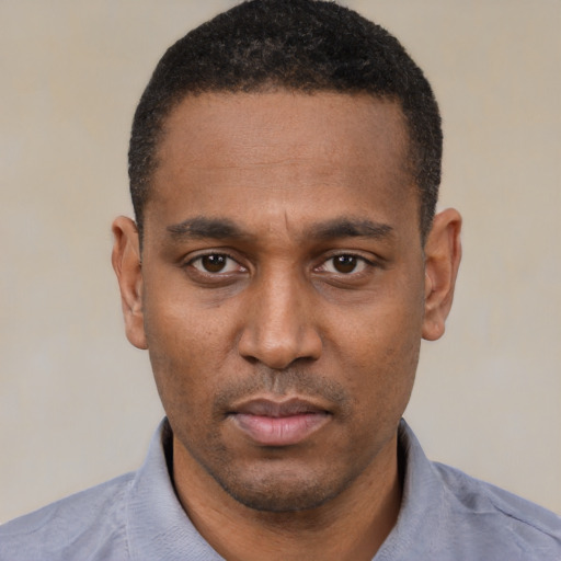 Neutral black young-adult male with short  black hair and brown eyes