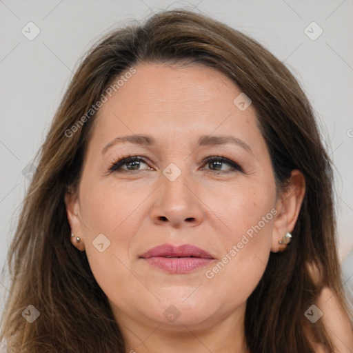 Joyful white adult female with long  brown hair and grey eyes